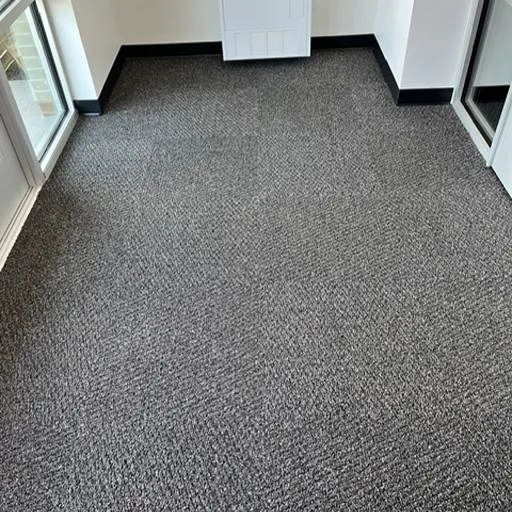textured grey commercial carpet installation